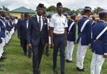 Okon Okon reviews parade at opening of Boys’ Brigade camp